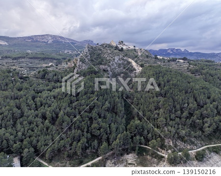 Vast mountain panorama, Dramatic cloudfilled skies over sprawling rural landscape and winding roads Vast mountain panorama, Dramatic cloudfilled skies over sprawling rural landscape and winding roads 139150216