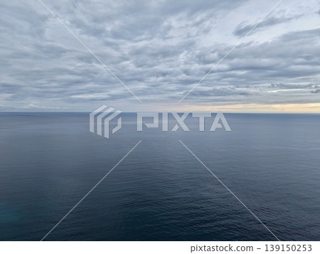 Romantic coastal sunset scene, Golden sunlight bathes sea and cliffs creating romantic atmosphere Romantic coastal sunset scene, Golden sunlight bathes sea and cliffs creating romantic atmosphere 139150253