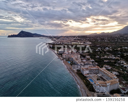 City skyline overview, Panoramic city scene adjacent to shoreline with mountainous background City skyline overview, Panoramic city scene adjacent to shoreline with mountainous background 139150258