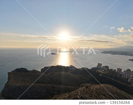 Peaceful coastal landscape view, Golden evening glow reflecting on peaceful sea and distant island 139150268
