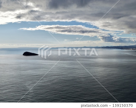 Calm horizon with gentle cloud images, Peaceful ocean scene featuring soft clouds and subtle lighting 139150370