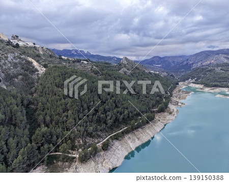 Scenic coastal panorama, Vast mountain and ocean scene, Serene bay with mountain range background Scenic coastal panorama, Vast mountain and ocean scene, Serene bay with mountain range background 139150388