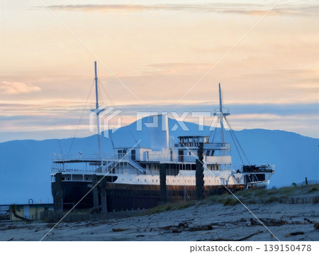 Vintage boat scene. Recall of tranquil maritime scene featuring vintage cruise ship and soft sunset 139150478