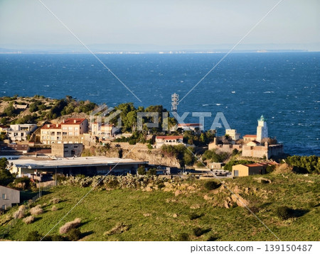 Bright lighthouse guides. Shining beacon provides secure navigation for ships entering and leaving port Bright lighthouse guides. Shining beacon provides secure navigation for ships entering and leaving port 139150487