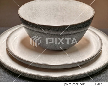 Artisan crafted stoneware with matte glaze and speckled neutral gray tones for elegant dining 139150799