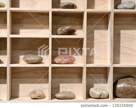 Serene collection of river stones beautifully arranged with soft natural illumination and neutral tones 139150809
