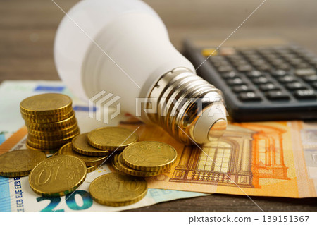 Cost of electric utilities with light bulb for payment. Cost of electric utilities with light bulb for payment. 139151367