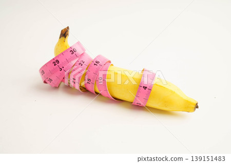 Banana with measuring tape, penis health. Banana with measuring tape, penis health. 139151483