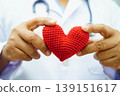 Asian woman doctor holding red heart for health in hospital. 139151617