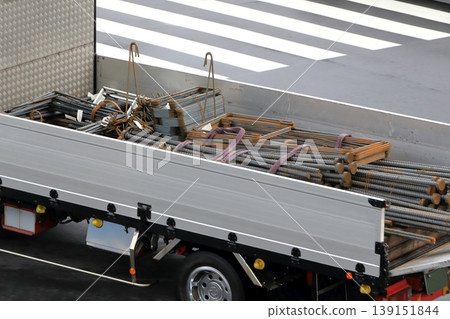Trucks transporting reinforcing bars 139151844