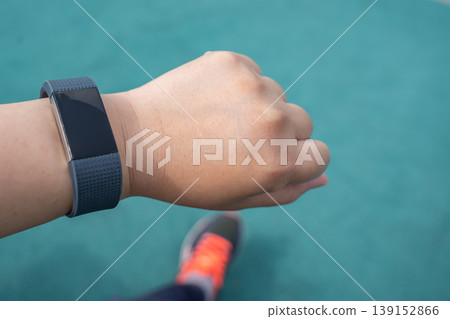 Checking my smartwatch while running Checking my smartwatch while running 139152866