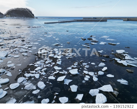 Aerial view of the drift ice formations in the harbor near the Utoro Shiretoko roadside station. Aerial view of the drift ice formations in the harbor near the Utoro Shiretoko roadside station. 139152922