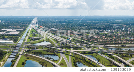 Wide multilane highway crossroads in Miami, Florida with fast driving cars. Above view of USA transportation infrastructure 139153059