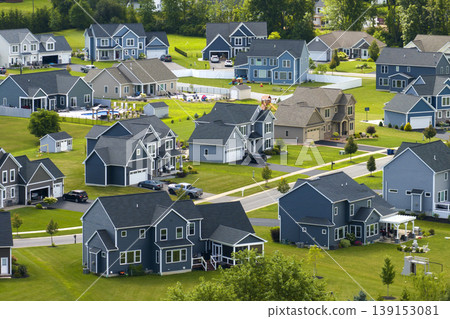 View from above of residential houses in living area in Rochester, NY. American dream homes as example of real estate development in US suburbs View from above of residential houses in living area in Rochester, NY. American dream homes as example of real estate development in US suburbs 139153081