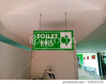 Hanging signboard for toilet directions photo Hanging signboard for toilet directions photo 139155278