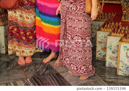 Three women visiting a temple in Bangkok Three women visiting a temple in Bangkok 139155396
