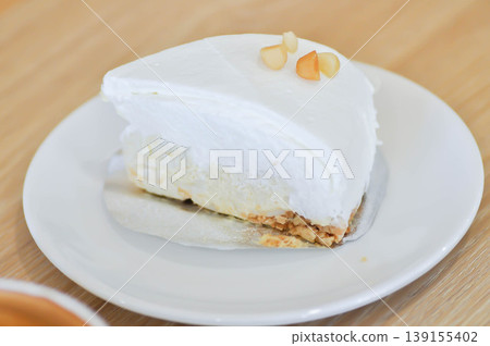coconut tart or coconut cake or sponge cakeor coconut tart with macadamia 139155402