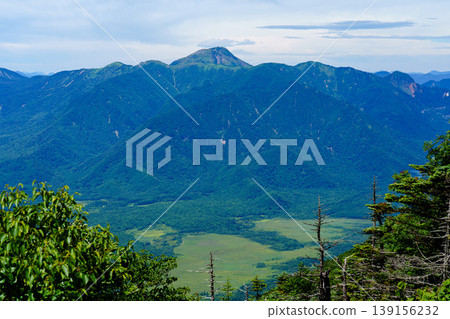 A breathtaking view of Mount Nikko-Shirane and the surrounding mountain landscape from the summit of Mount Nantai - a spectacular sight in Tochigi Prefecture. A breathtaking view of Mount Nikko-Shirane and the surrounding mountain landscape from the summit of Mount Nantai - a spectacular sight in Tochigi Prefecture. 139156232