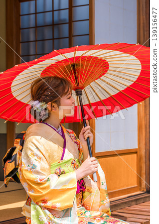 A young Japanese woman in a furisode kimono in a Japanese-style room (coming-of-age ceremony, 20th birthday celebration) A young Japanese woman in a furisode kimono in a Japanese-style room (coming-of-age ceremony, 20th birthday celebration) 139156477