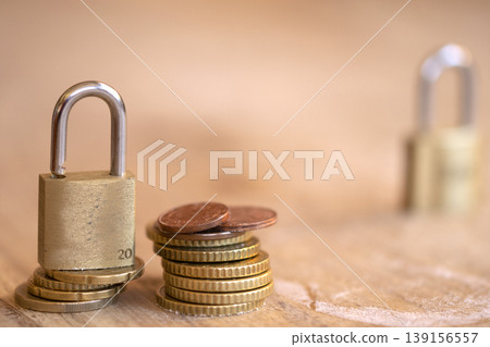 Padlock on Stack of Euro Coins for Financial Security Concept Padlock on Stack of Euro Coins for Financial Security Concept 139156557