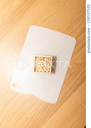 Soybeans in a measuring box placed on a cutting board Soybeans in a measuring box placed on a cutting board 139157105