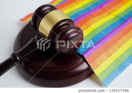 Gavel for judge lawyer on rainbow flag, symbol of LGBT pride month. Gavel for judge lawyer on rainbow flag, symbol of LGBT pride month. 139157306