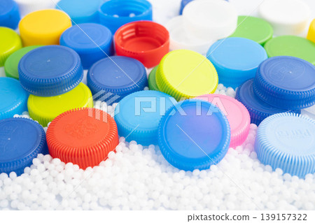 Bangkok, Thailand April 20, 2024 Plastic recycle pellets and caps for industrial use. Bangkok, Thailand April 20, 2024 Plastic recycle pellets and caps for industrial use. 139157322