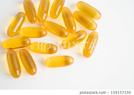 Fish oil or Cod liver oil gel in capsules with omega 3 vitamins, supplementary healthy food. Fish oil or Cod liver oil gel in capsules with omega 3 vitamins, supplementary healthy food. 139157330