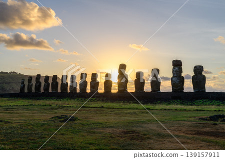 Stoic moai statue row silhouette during serene sunset on easter island chile 139157911