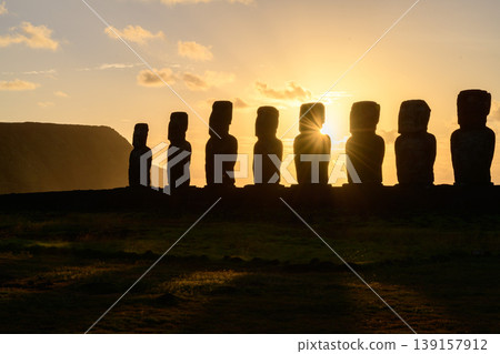 Majestic and peaceful moai statue silhouette at sunset on easter island chile Majestic and peaceful moai statue silhouette at sunset on easter island chile 139157912