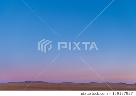 Serene clear sky at dusk over peaceful mountain landscape Serene clear sky at dusk over peaceful mountain landscape 139157937
