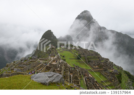 Majestic machu picchu ancient stone ruin hidden in mysterious mountain fog Majestic machu picchu ancient stone ruin hidden in mysterious mountain fog 139157964