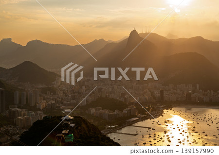 Beautiful golden sunset view over mountains and bay of Rio de Janeiro Brazil from Sugarloaf Mountain serene scene 139157990