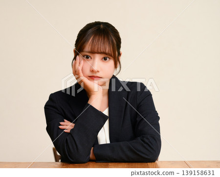 A young woman who looks bored A young woman who looks bored 139158631