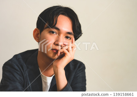 Young man thinking Young man thinking 139158661