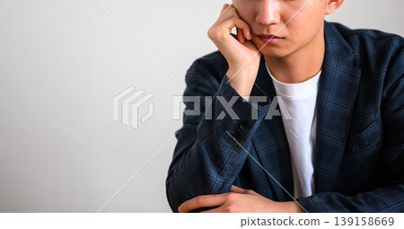 Young man thinking Young man thinking 139158669