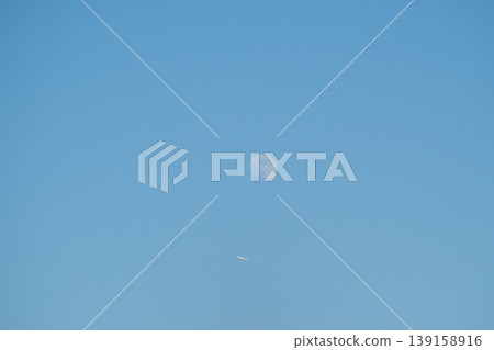 Moon and plane in the blue sky Moon and plane in the blue sky 139158916