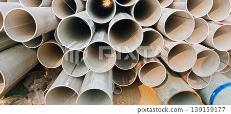 Stack of industrial steel pipes at a construction project site Stack of industrial steel pipes at a construction project site 139159177