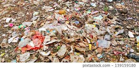Plastic waste in an open field 139159180