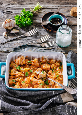 Indian fish curry with cauliflower and green peas 139159760