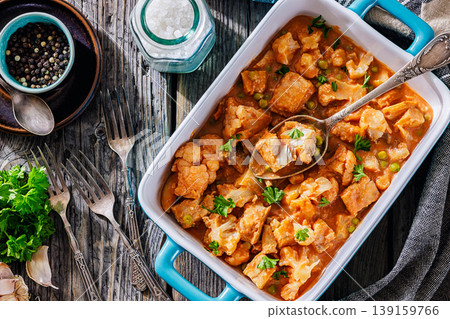 Indian fish curry with cauliflower and green peas 139159766