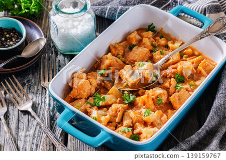 Indian fish curry with cauliflower and green peas Indian fish curry with cauliflower and green peas 139159767
