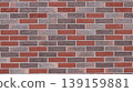Beautiful grainy brick wall texture made of red, blue and gray blocks, graphic resource for background use with empty copy space on bright mottled textured brickwork 139159881