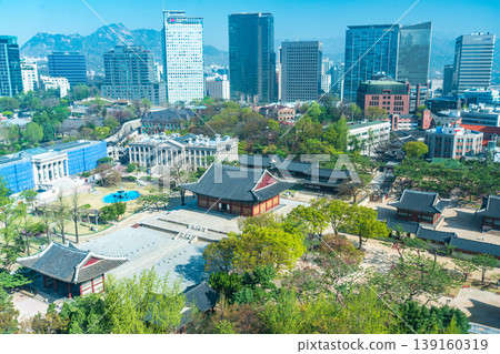 Seoul, South Korea - Apr. 12 , 2026 : Aerial view of Deoksugung Palace with modern skyscrapers in Seoul, South Korea Seoul, South Korea - Apr. 12 , 2026 : Aerial view of Deoksugung Palace with modern skyscrapers in Seoul, South Korea 139160319