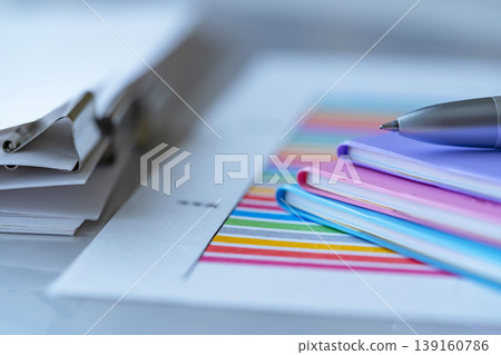 Graphs, documents and notebooks on a table Graphs, documents and notebooks on a table 139160786