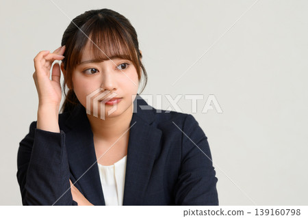 A young woman thinking 139160798