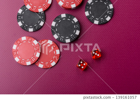 Casino dice and chips on a colored background, poker, gambling with bets. Dice and chips Casino dice and chips on a colored background, poker, gambling with bets. Dice and chips 139161057
