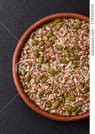 Shelled sunflower, sesame, pumpkin, and flaxseed kernels as ingredients for healthy food Shelled sunflower, sesame, pumpkin, and flaxseed kernels as ingredients for healthy food 139161058