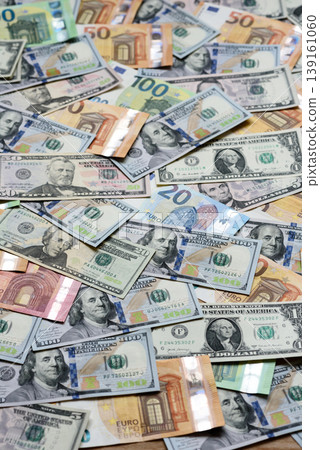Euro and dollar banknotes, exchange, sales, economic tariffs and taxes. Euros and dollars Euro and dollar banknotes, exchange, sales, economic tariffs and taxes. Euros and dollars 139161060