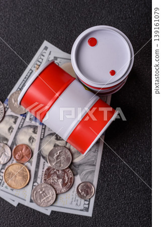 A barrel of oil against a backdrop of dollars as a concept for the oil crisis. A barrel of oil A barrel of oil against a backdrop of dollars as a concept for the oil crisis. A barrel of oil 139161079